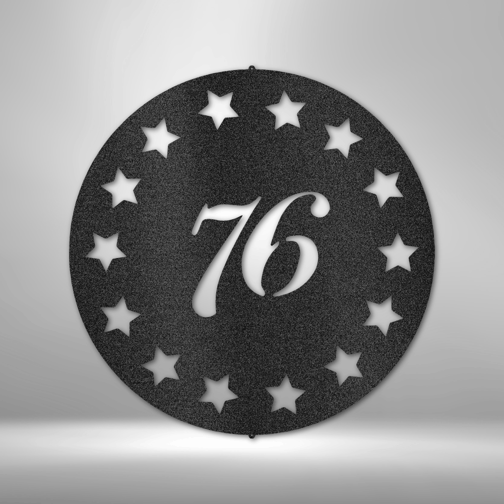 Round patriotic metal wall art with “76” script and 13-star design in patriotic theme