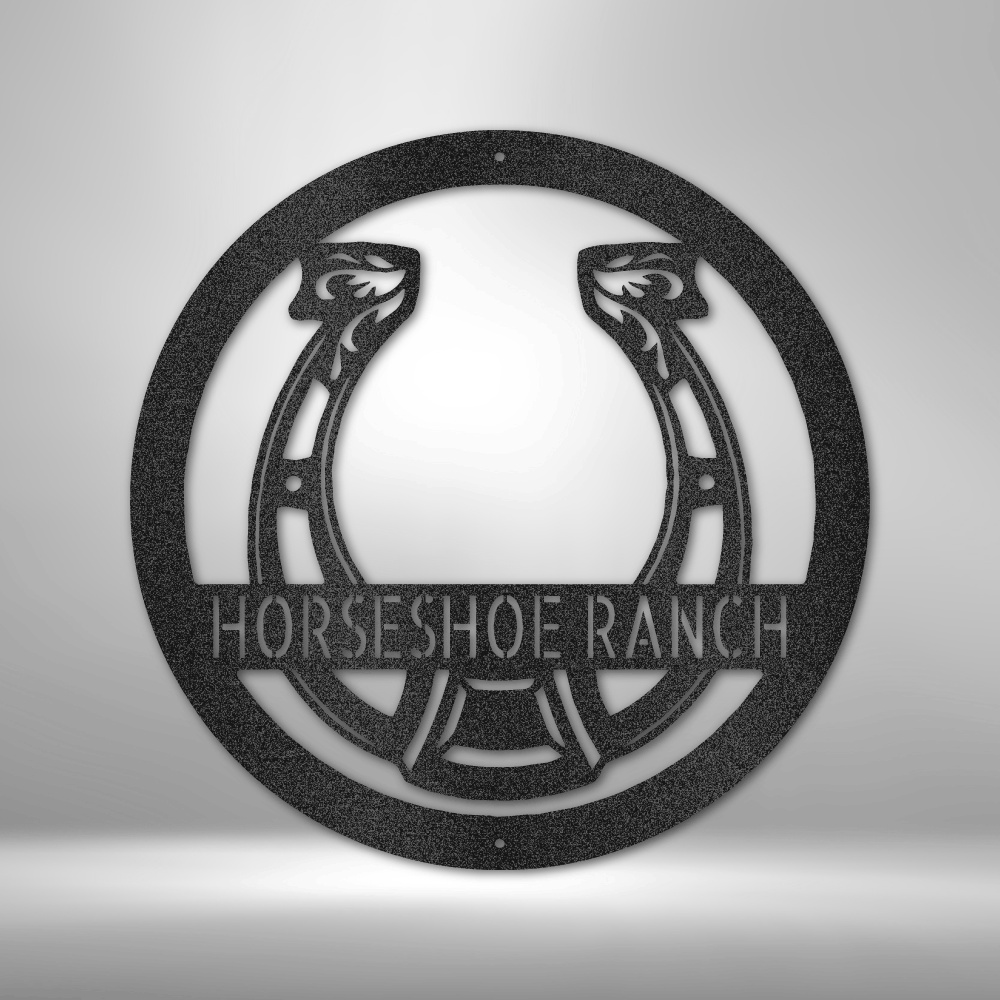 Custom steel horseshoe wall sign with personalized ranch name across center