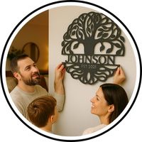 A custom steel sign being hung by a family with the family name across the bottom of a Tree of Life metal wall design.