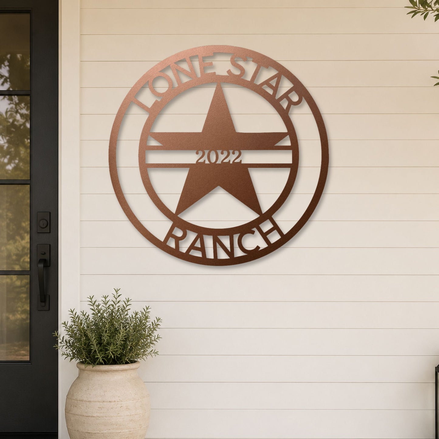 Lone Star Monogram steel sign in copper finish displayed outdoors
